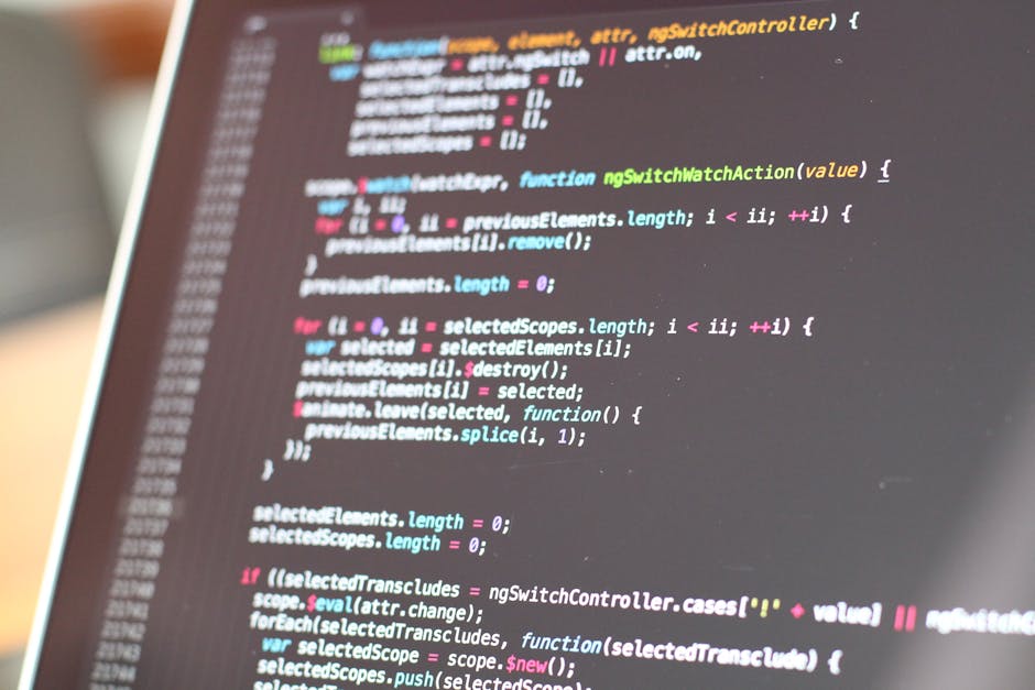 The image displays a computer screen filled with lines of code consisting of various colorful text, including red, green, blue, and purple characters, on a dark background. The code appears to be HTML
